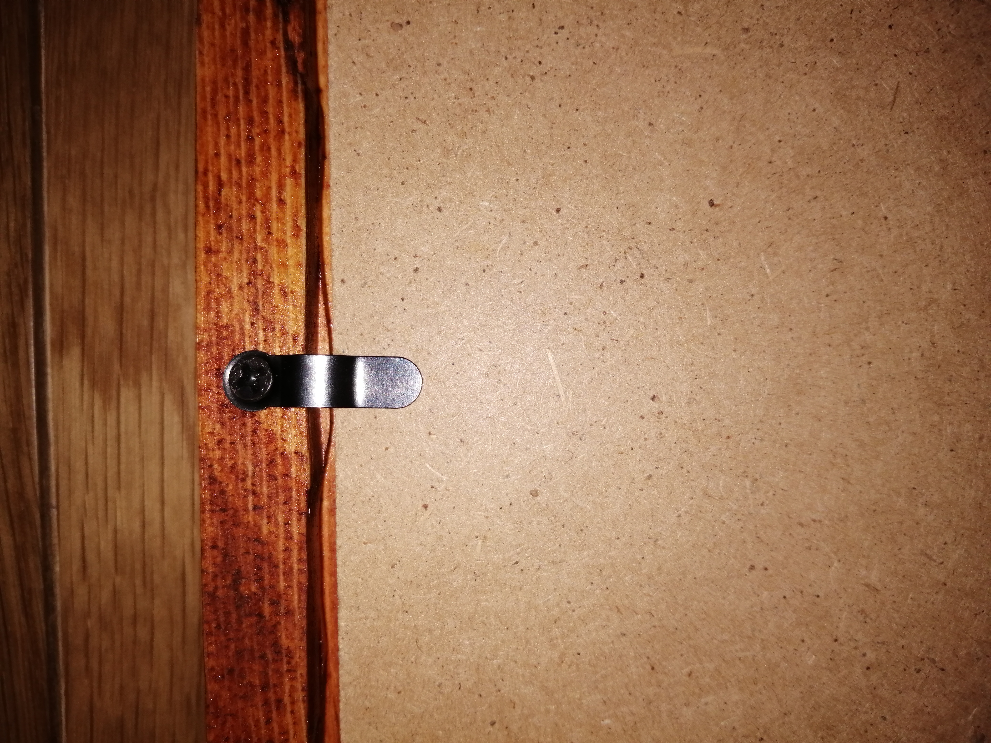 Fixtures for holding glass, etc in frame