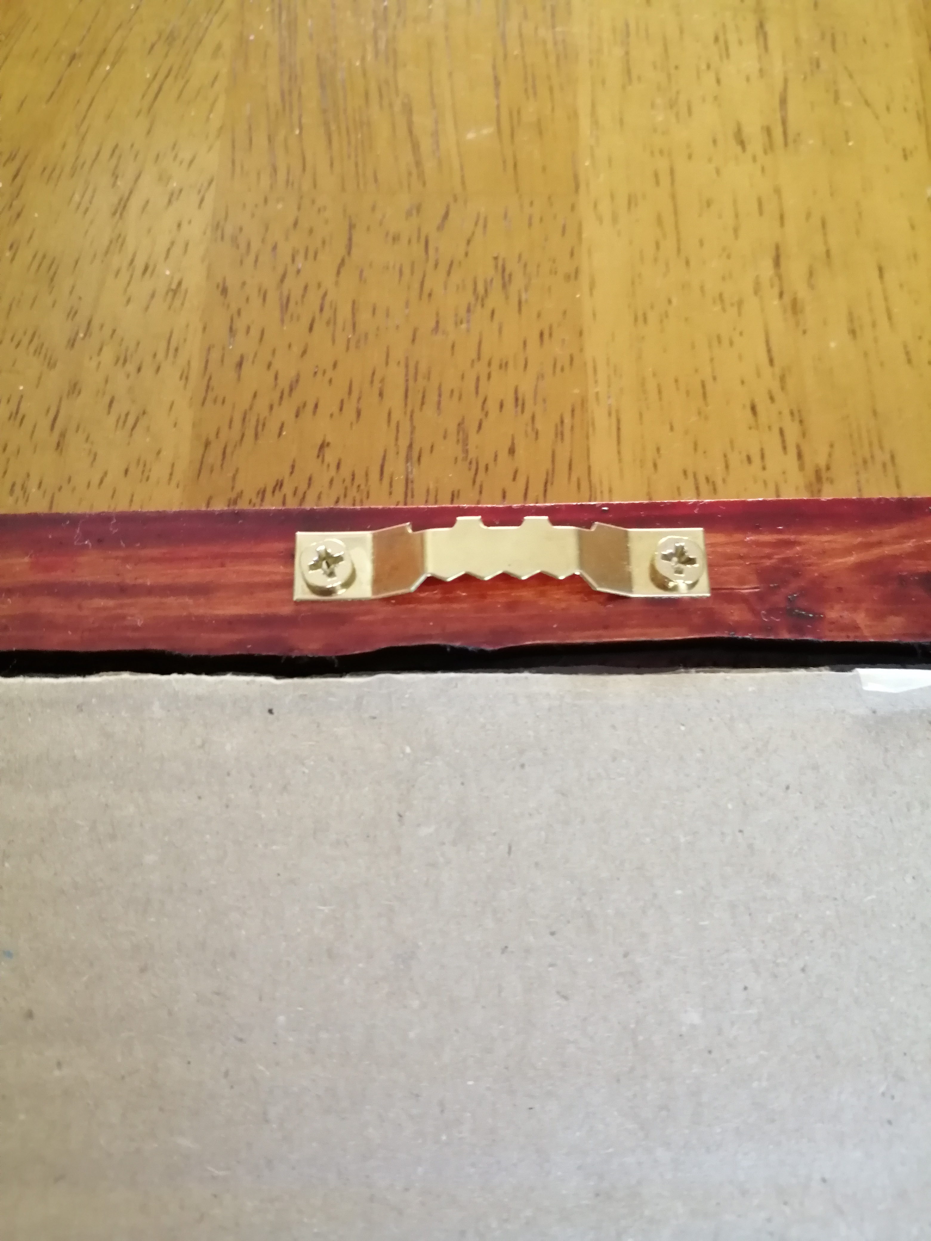 Fixtures for holding frame on wall - sawtooth type